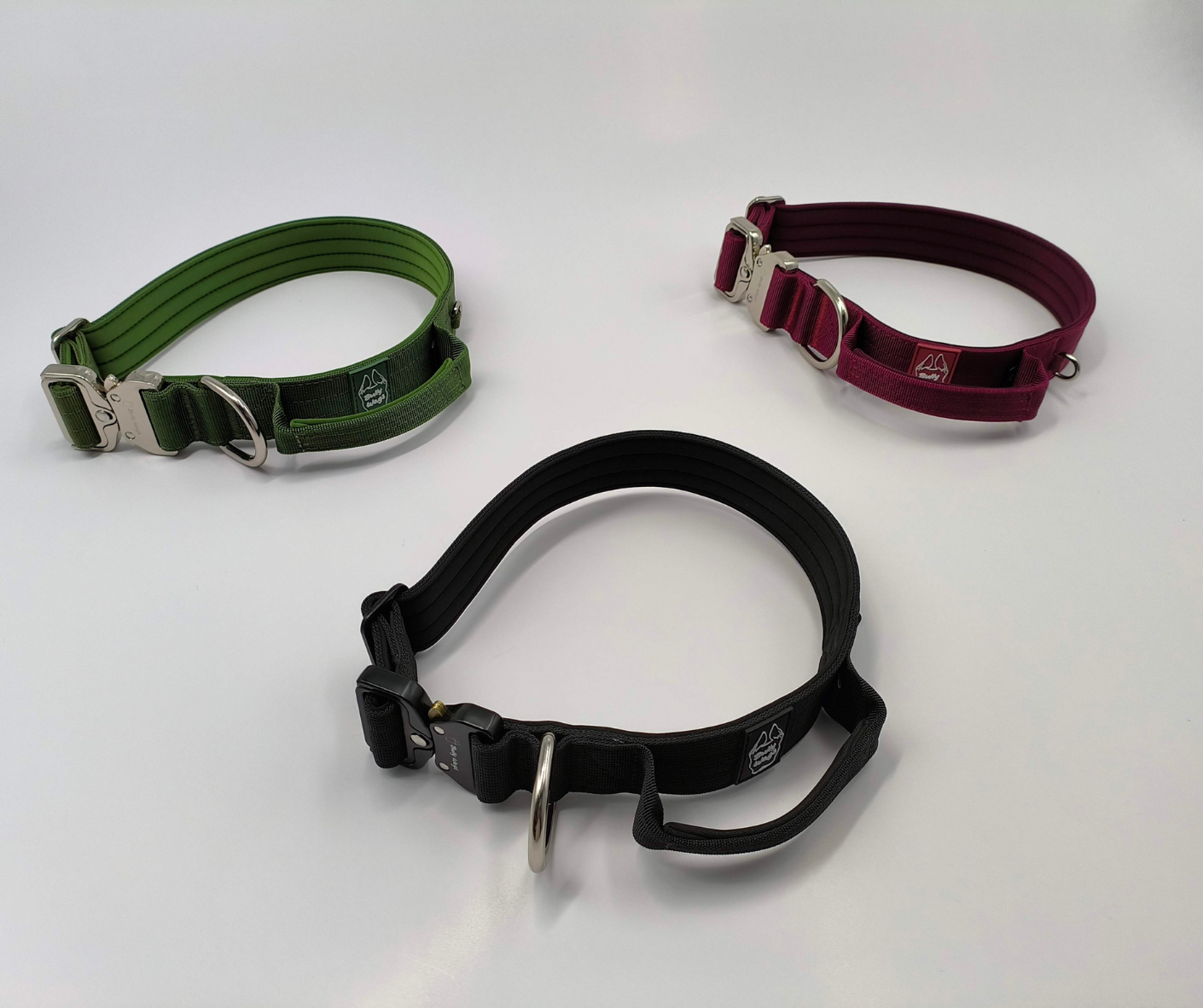 Black, cherry wine, and cactus green nylon dog collars displayed side by side on a white background.