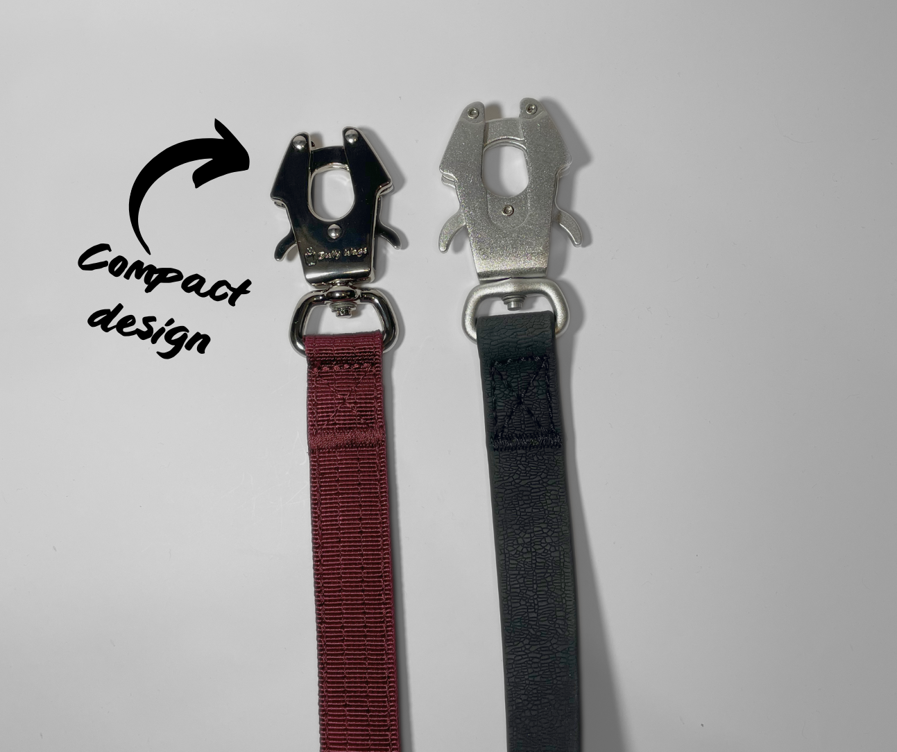 Comparison of black frog clips used on dog leashes, featuring black zinc alloy hardware on a nylon leash and aluminum hardware on a waterproof PVC leash.