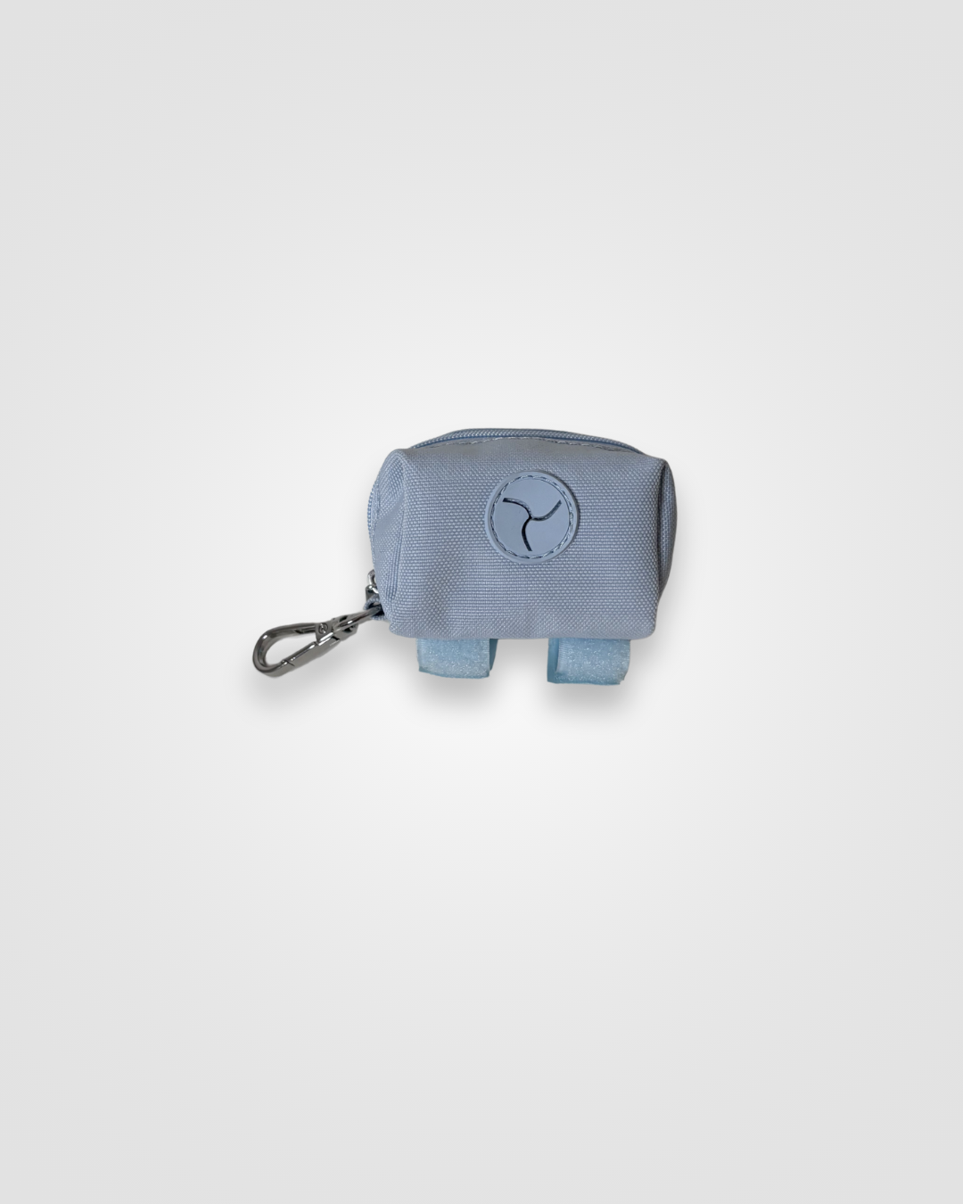 Baby blue dog poop bag dispenser with carabiner displayed on a white background.