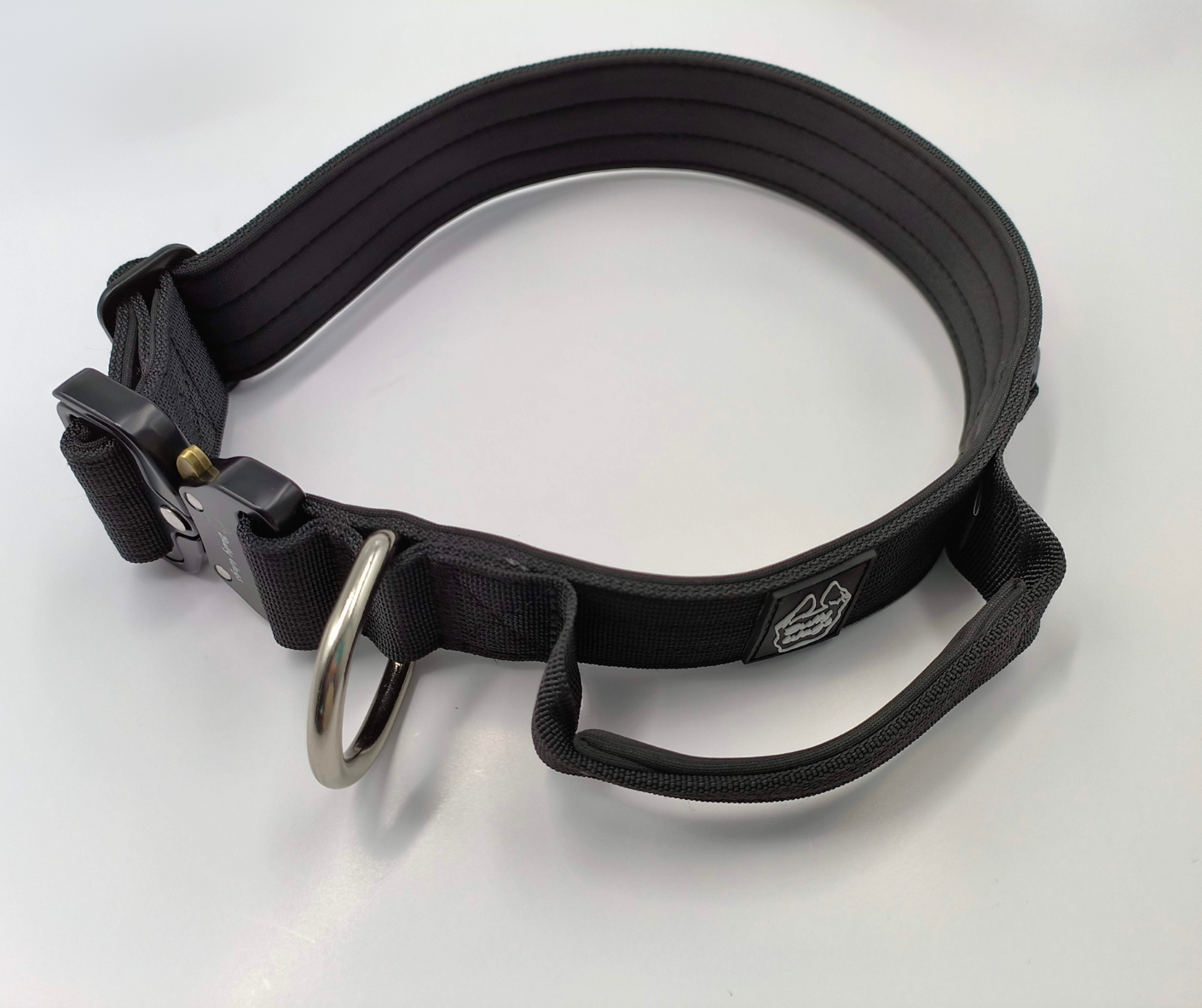 Black 1.5-inch nylon dog collar with a handle, black metal buckle, and black hardware, displayed on a white background.