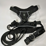 Black Heavy Duty harness, matching dog collar, and matching nylon leash set displayed on a white background.