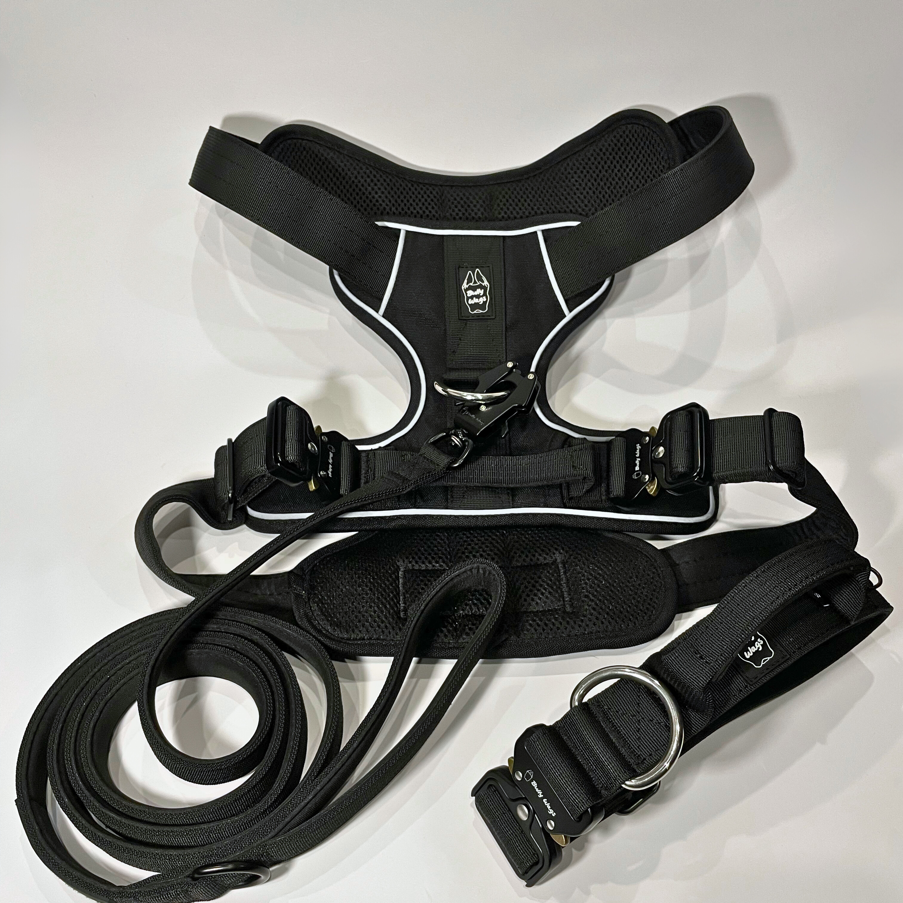Black Heavy Duty harness, matching dog collar, and matching nylon leash set displayed on a white background.