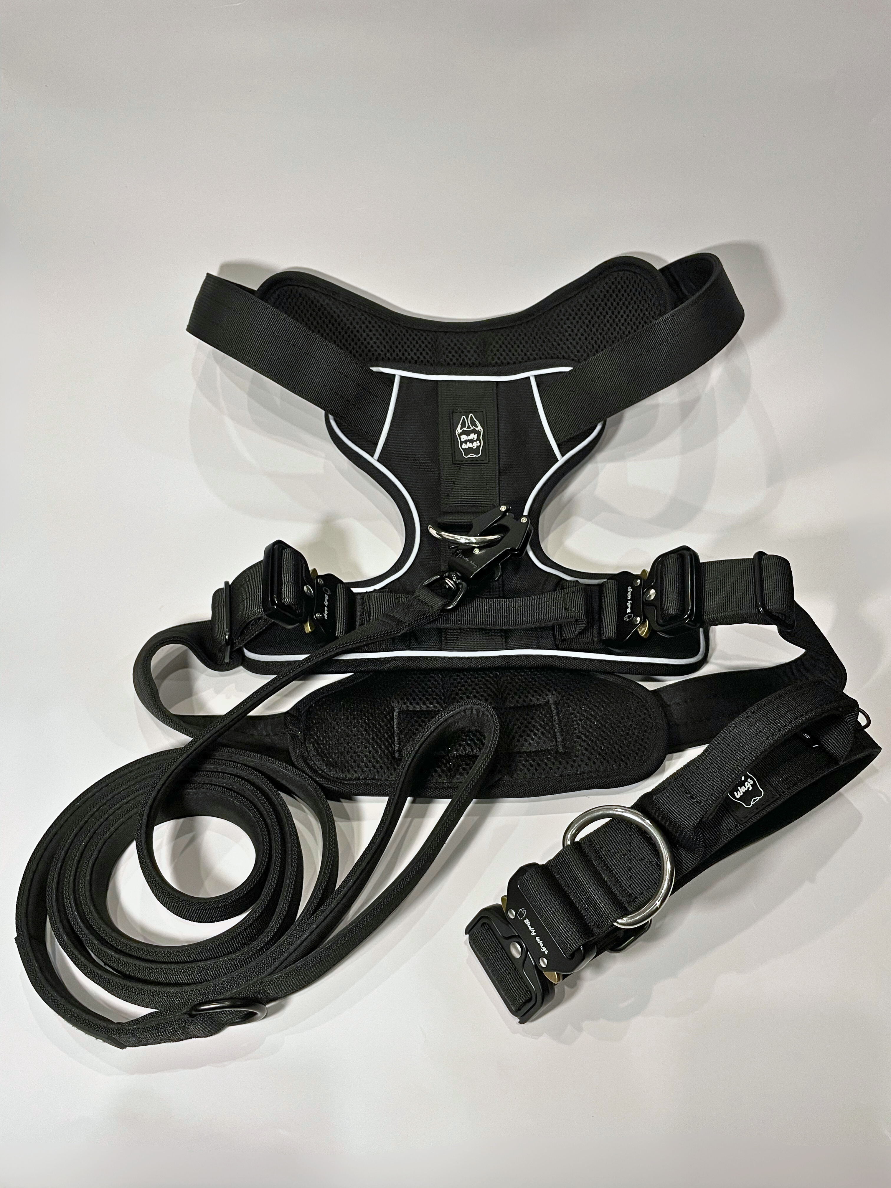 Black Heavy Duty harness, matching dog collar, and matching nylon leash set displayed on a white background.