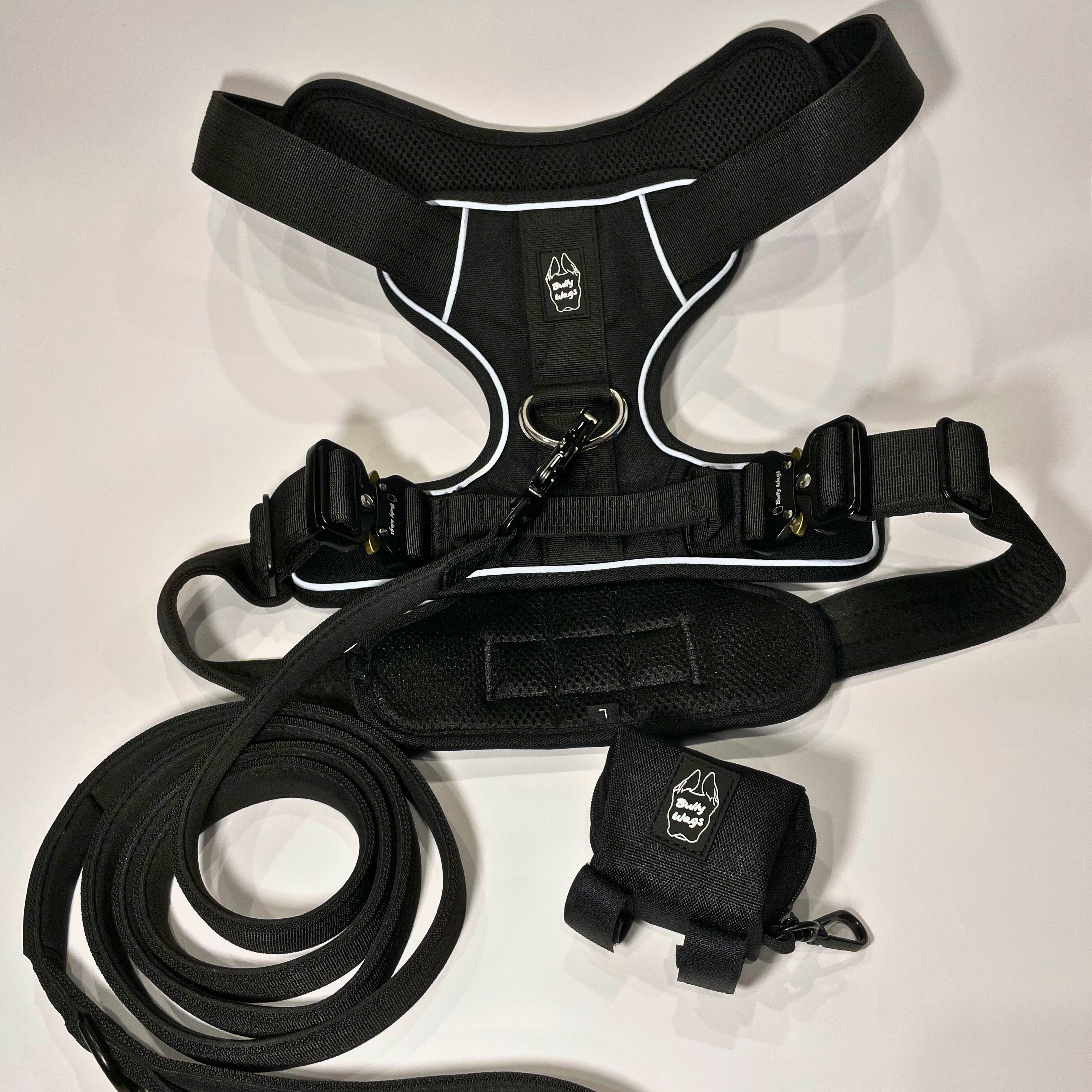 Black Heavy Duty harness, matching nylon leash, and portable poop bag dispenser set displayed on a white background.