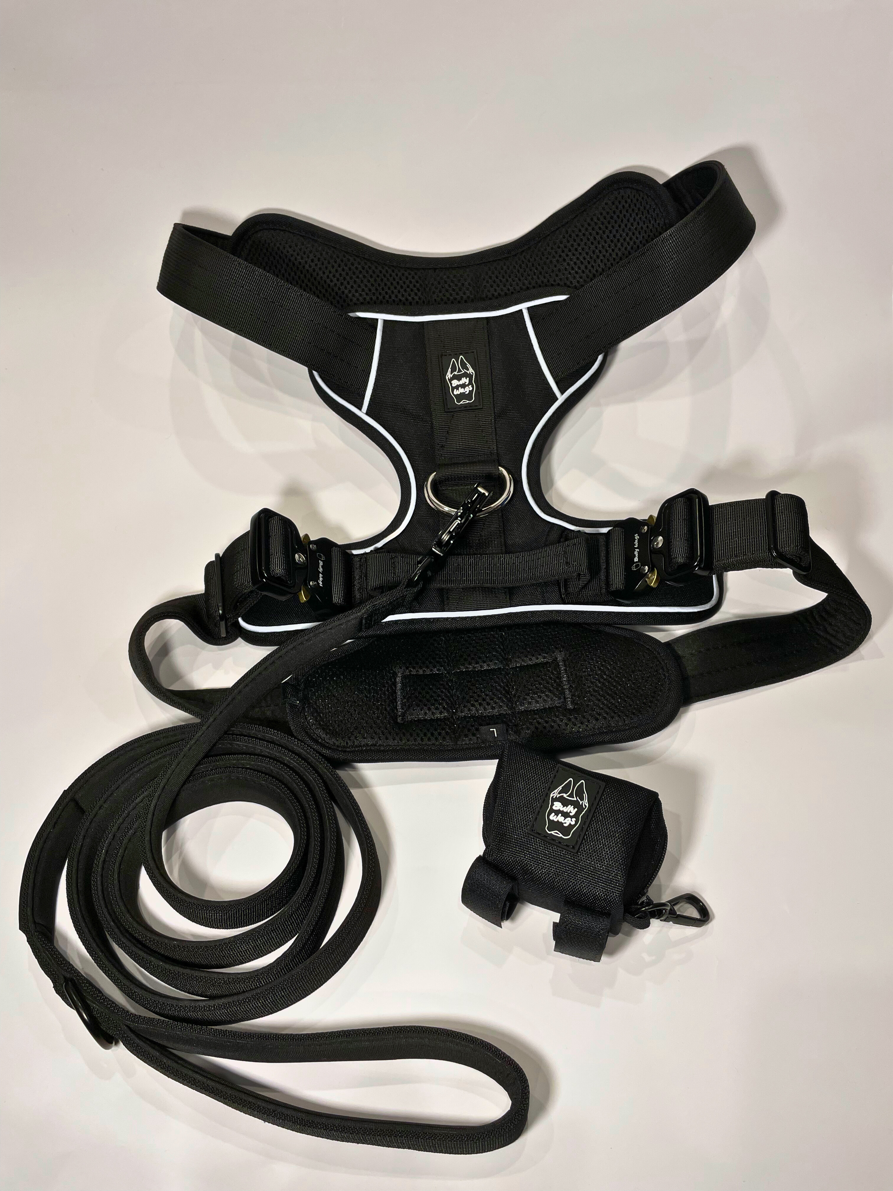 Black Heavy Duty harness, matching nylon leash, and portable poop bag dispenser set displayed on a white background.