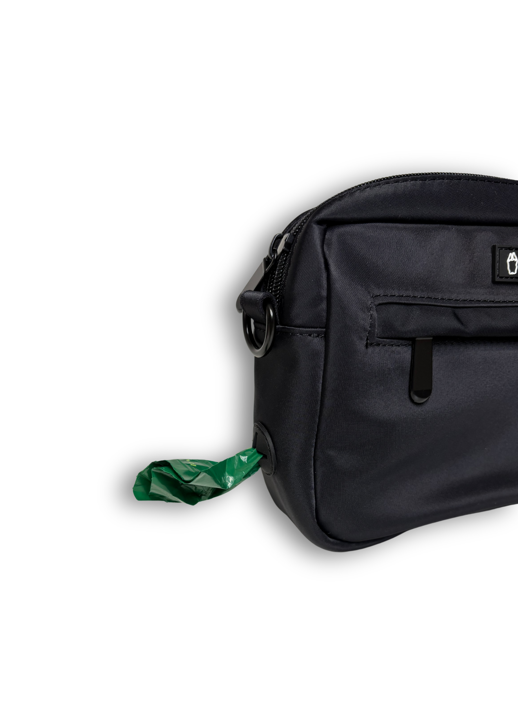 Black Bully Wags crossbody dog walking bag with a green poop bag attached, displayed on a white background.