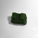 Cactus green portable poop bag dispenser showing the hook-and-loop attachment straps for securing the dispenser to a leash or bag.