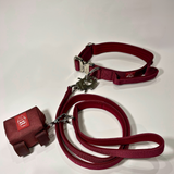 Cherry wine dog collar, matching nylon leash, and portable poop bag dispenser set displayed on a white background.