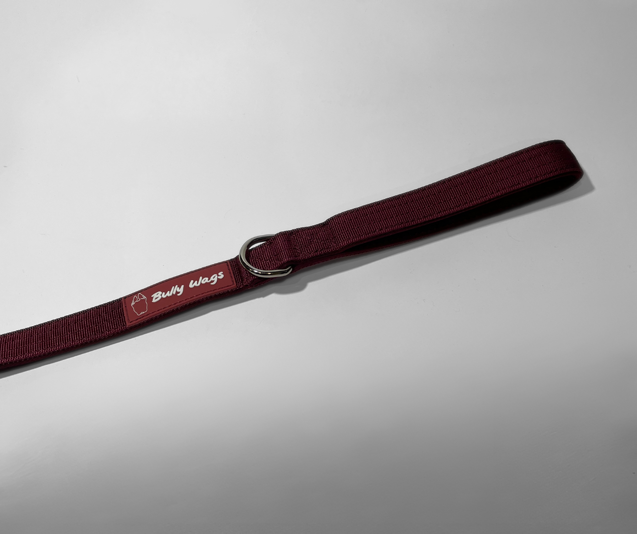 Cherry wine nylon dog leash with a D-ring attachment, shown in a close-up detail view on a white background.