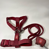 Cherry wine Y-strap dog harness, matching nylon leash, and portable poop bag dispenser set displayed on a white background.
