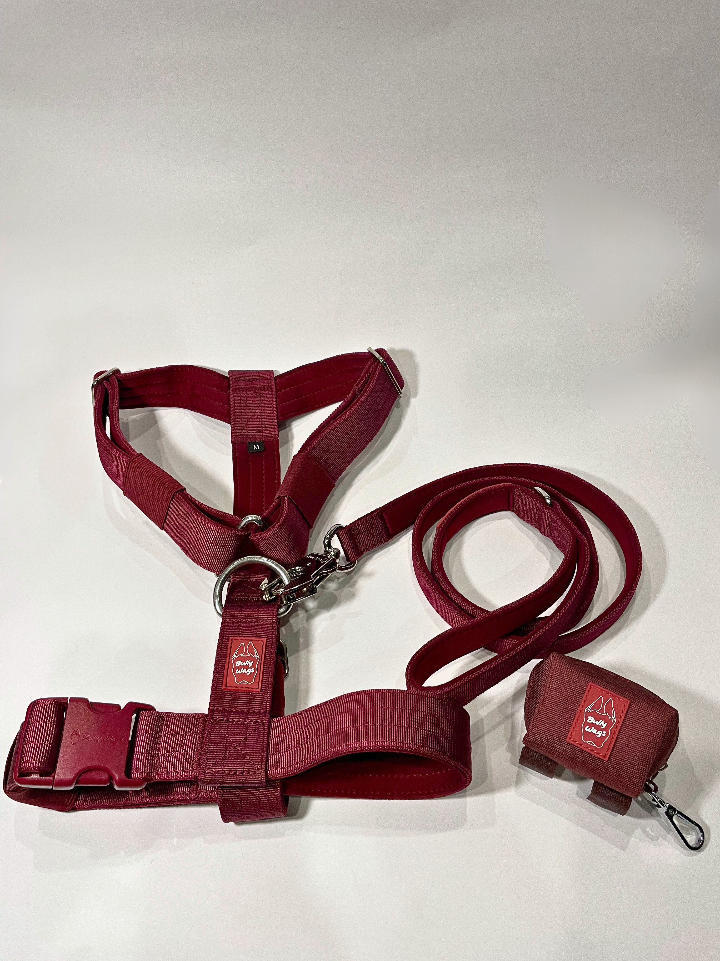 Cherry wine Y-strap dog harness, matching nylon leash, and portable poop bag dispenser set displayed on a white background.