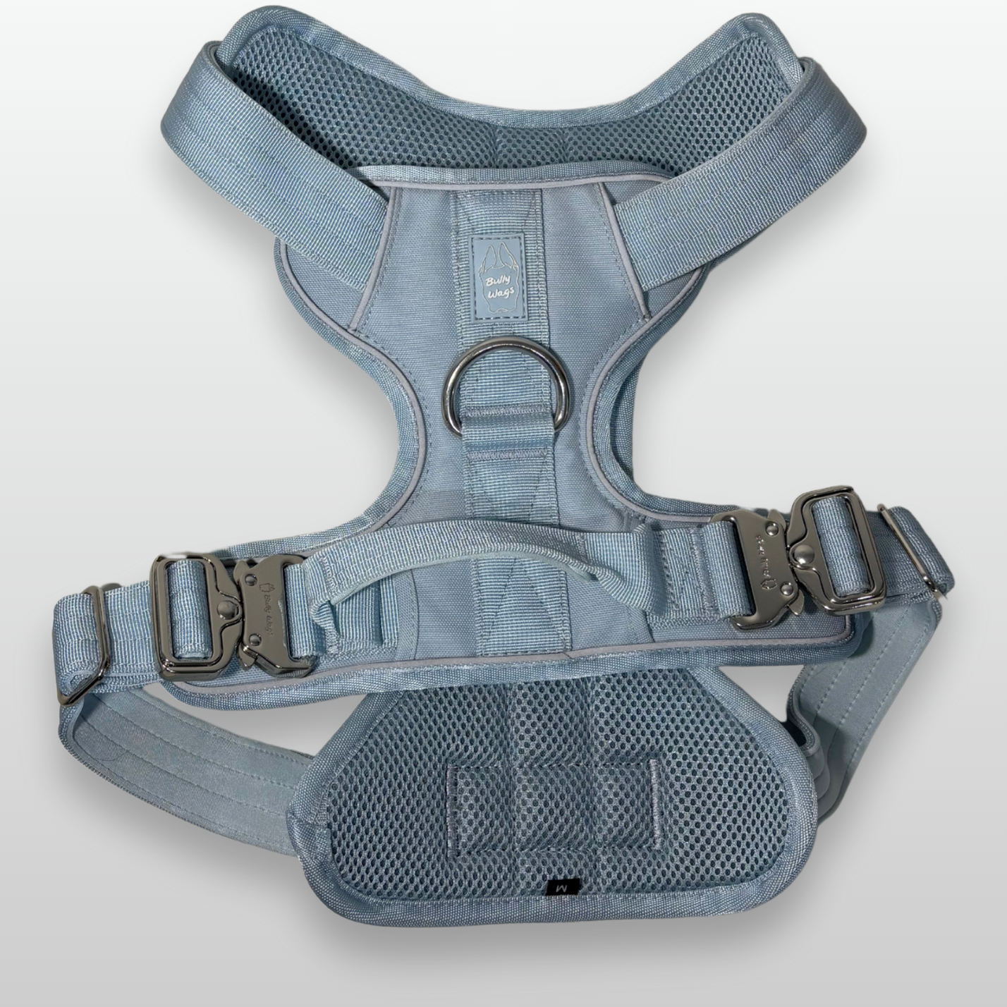 Baby Blue Heavy Duty dog harness shown from above, featuring silver hardware, breathable mesh padding, adjustable straps, and reflective trim on a light gray background.