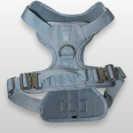 Baby Blue Heavy Duty dog harness shown from above, featuring silver hardware, breathable mesh padding, adjustable straps, and reflective trim on a light gray background.