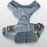 Baby Blue Heavy Duty dog harness shown from above, featuring silver hardware, breathable mesh padding, adjustable straps, and reflective trim on a light gray background.
