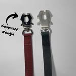 Comparison of black frog clips used on dog leashes, featuring black zinc alloy hardware on a nylon leash and aluminum hardware on a waterproof PVC leash.
