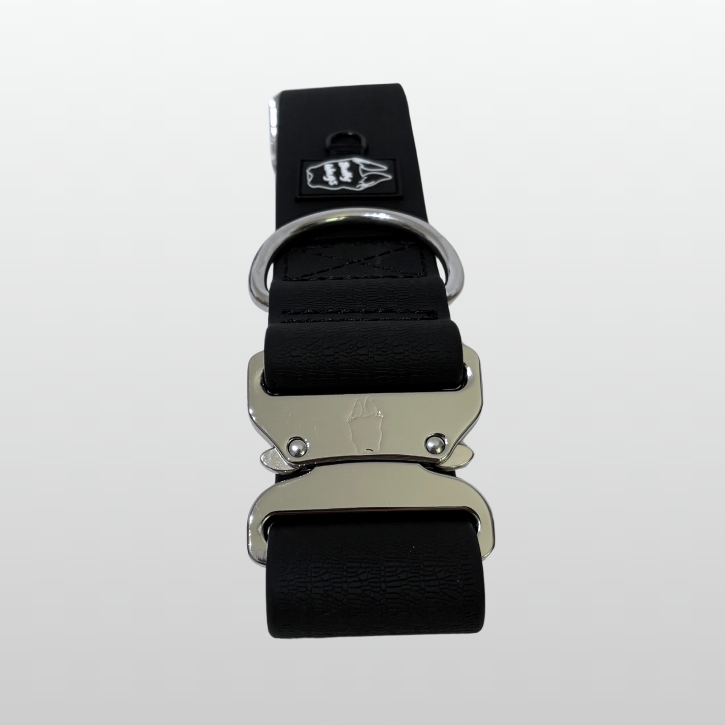 Black waterproof PVC dog collar with silver hardware displayed on a light gray background.