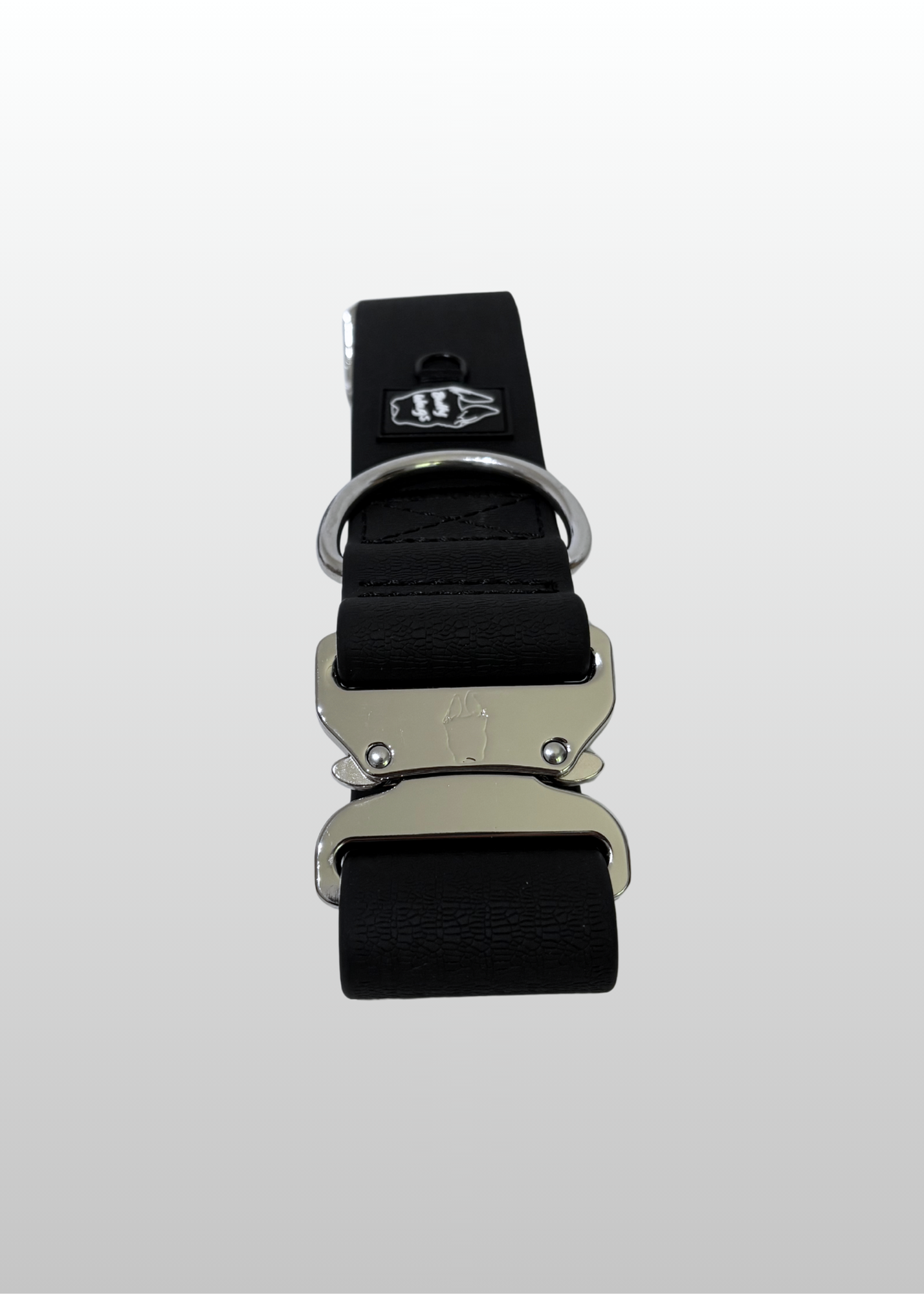 Black waterproof PVC dog collar with silver hardware displayed on a light gray background.