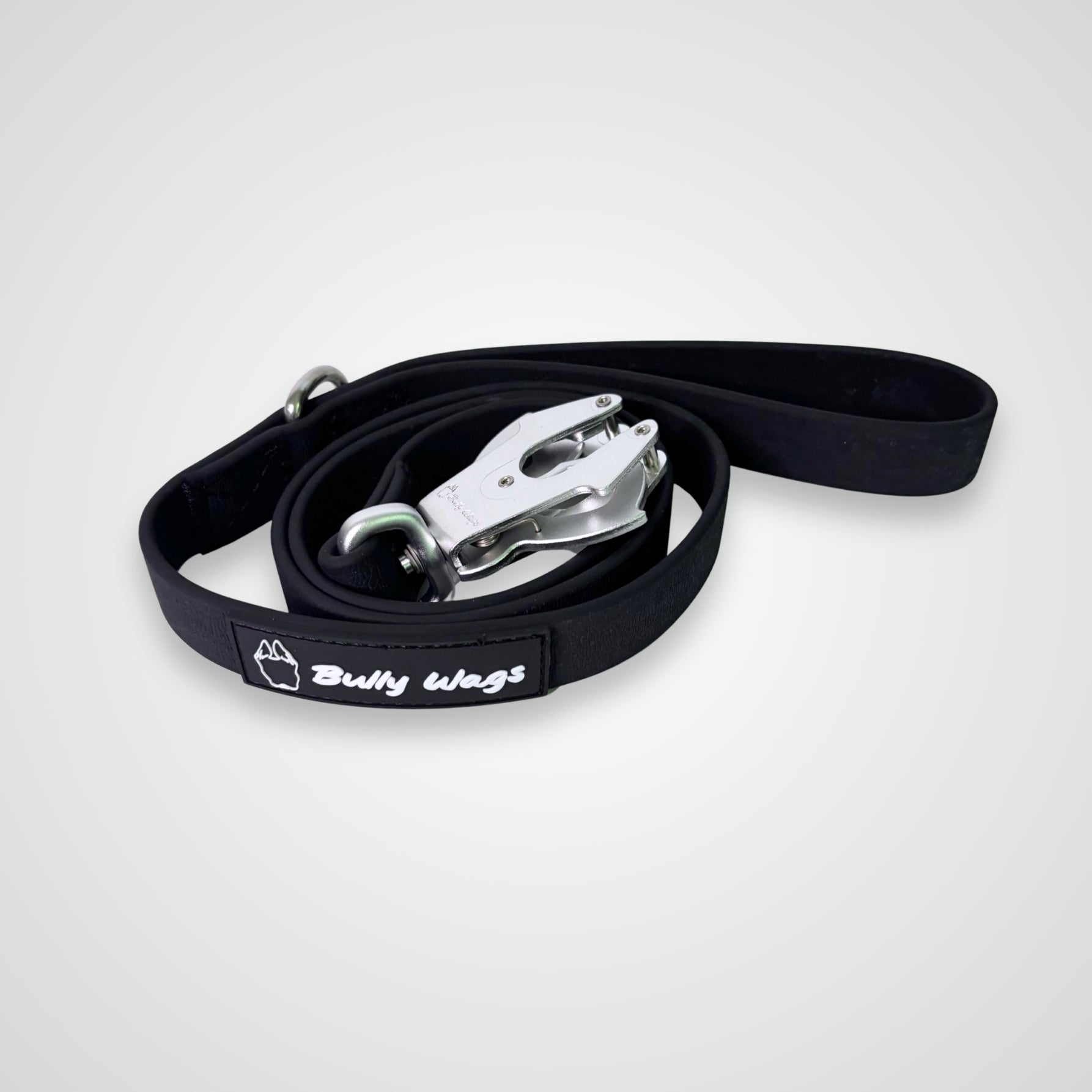 Black waterproof PVC dog leash with silver hardware and open frog clip, displayed on a light gray background.