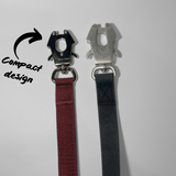 Comparison of black frog clips used on dog leashes, featuring black zinc alloy hardware on a nylon leash and aluminum hardware on a waterproof PVC leash.